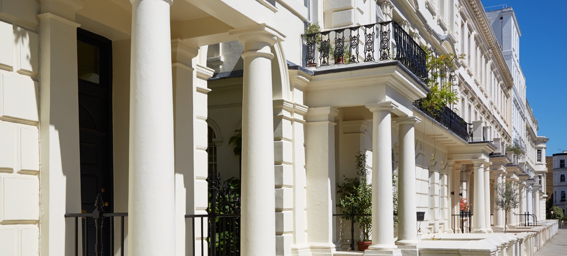 White luxury houses facades in London, borough of Kensington and