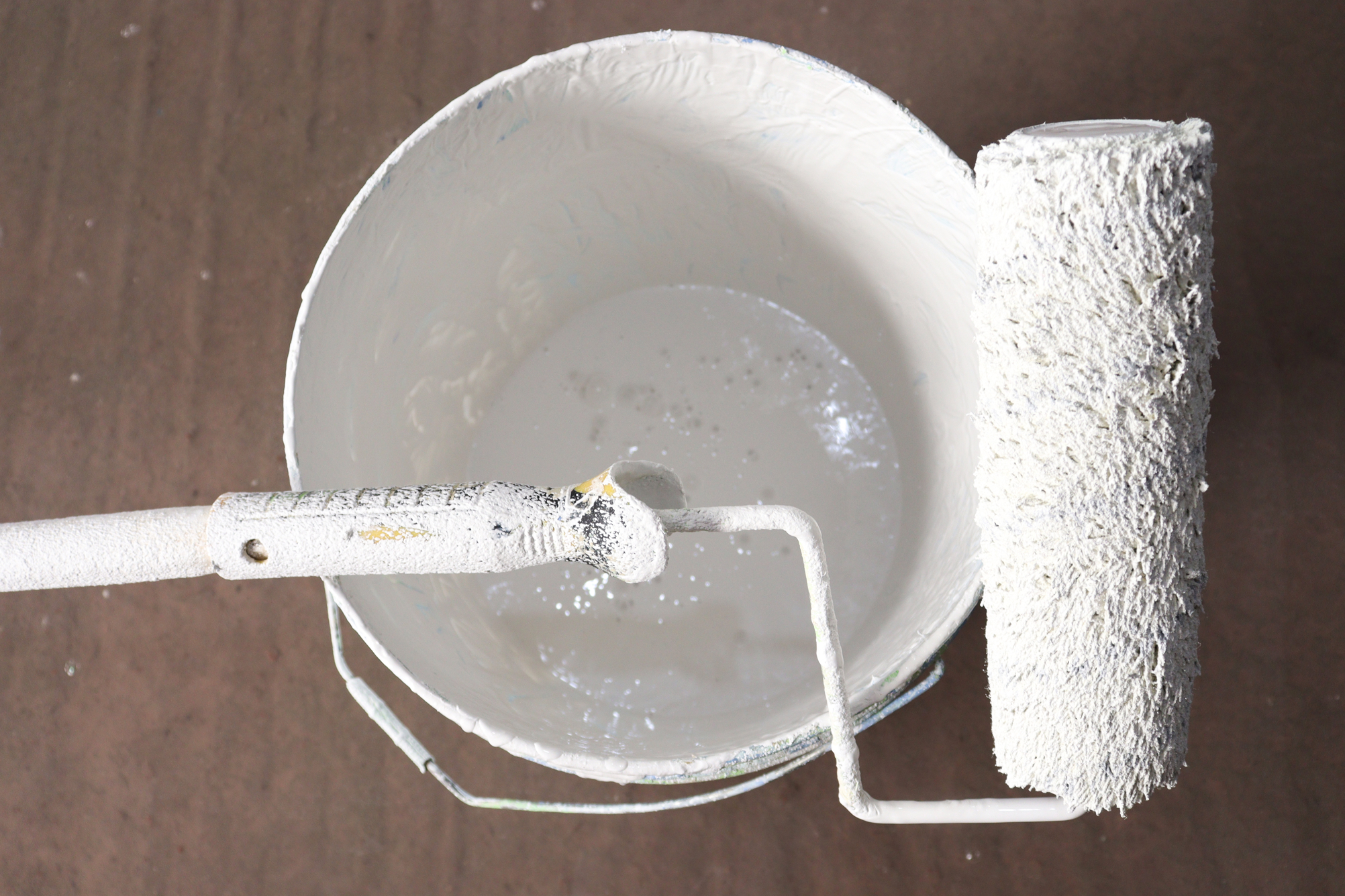 paint brush with paint on pot